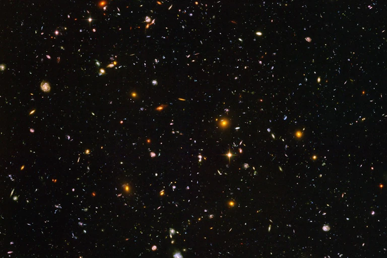 A picture of thousands of galaxies in space.