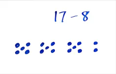 17 dots arranged into clusters of three fives and a two.