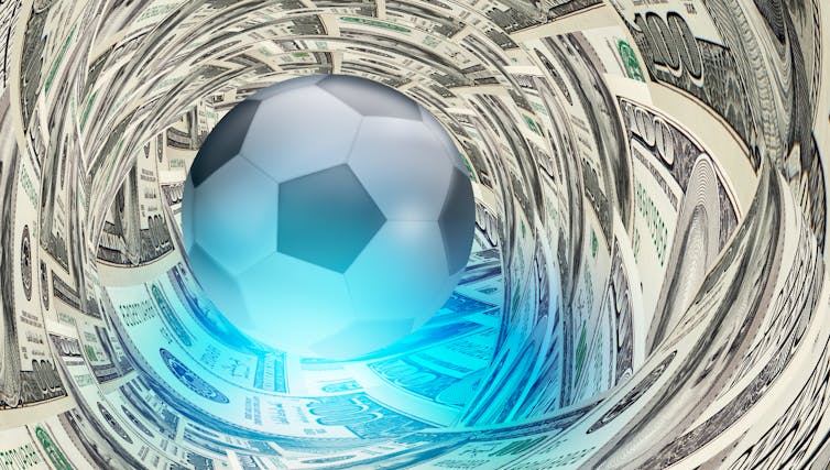 A football surrounded by dollar bills.