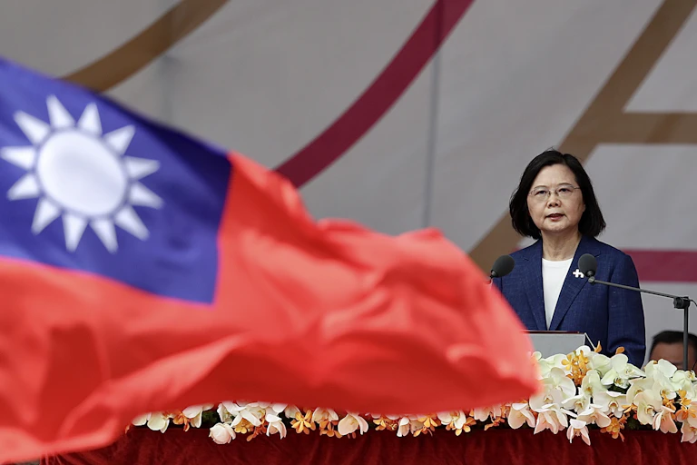 Taiwanese president, Tsai Ing-wen, delivers a speech with a Taiwanese national flag waving in the foreground.ei, Taiwan, 10 October 2021.
