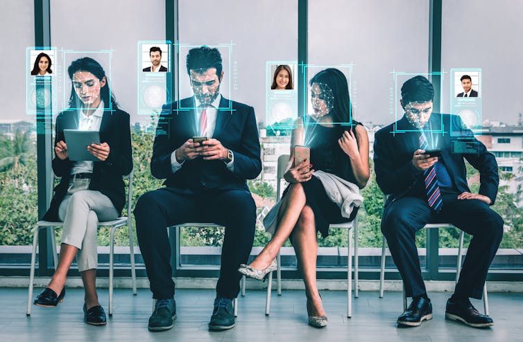 A row of four people in business attire on their mobile phones. Holograms of profile pictures float above them