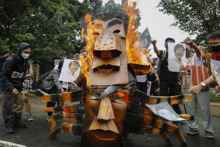 Protesters burn effigies of Duterte and Marcos Jr.