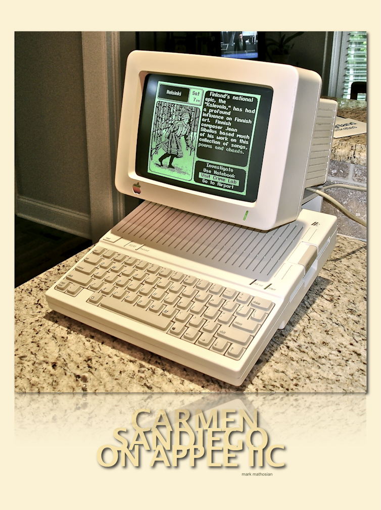 1980s computer with Carmen Sandiego on the screen.