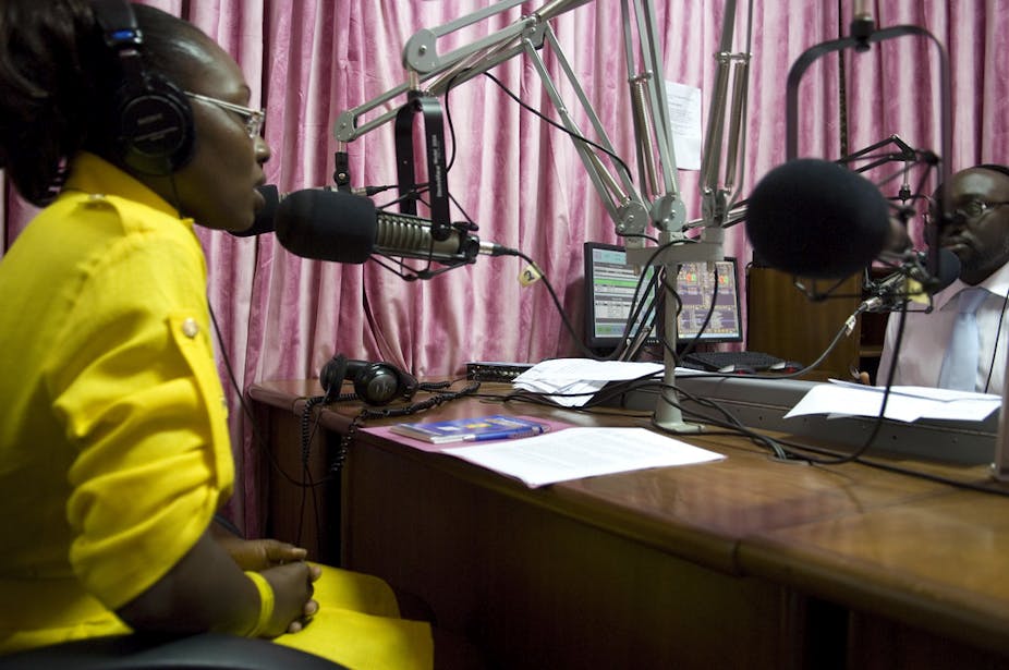 A woman being interviewed by a male radio host.