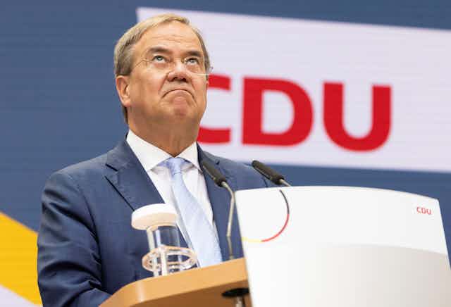 CDU election candidate Armin Laschet looks grim faced during a post-result press conference.