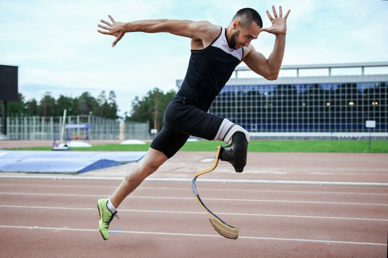 A paralympic blade runner on an athletics track