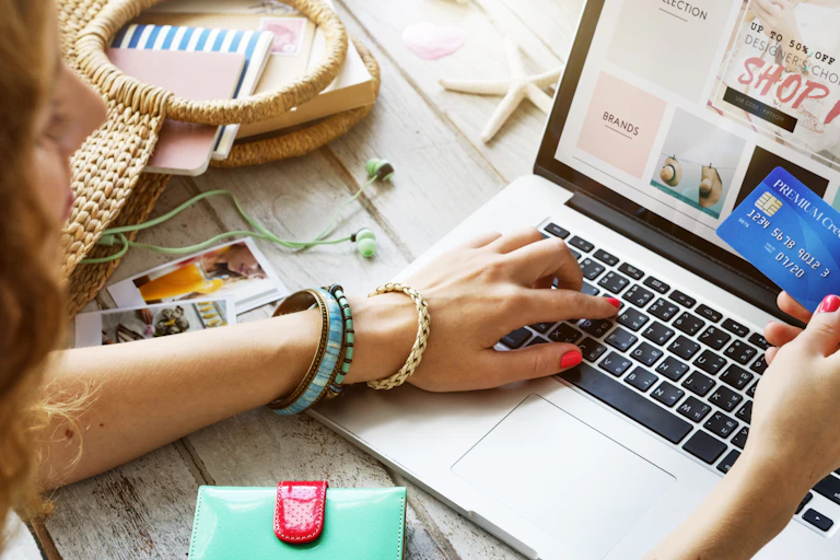 online shopper with credit card and laptop
