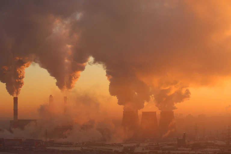 smoke billows from stacks