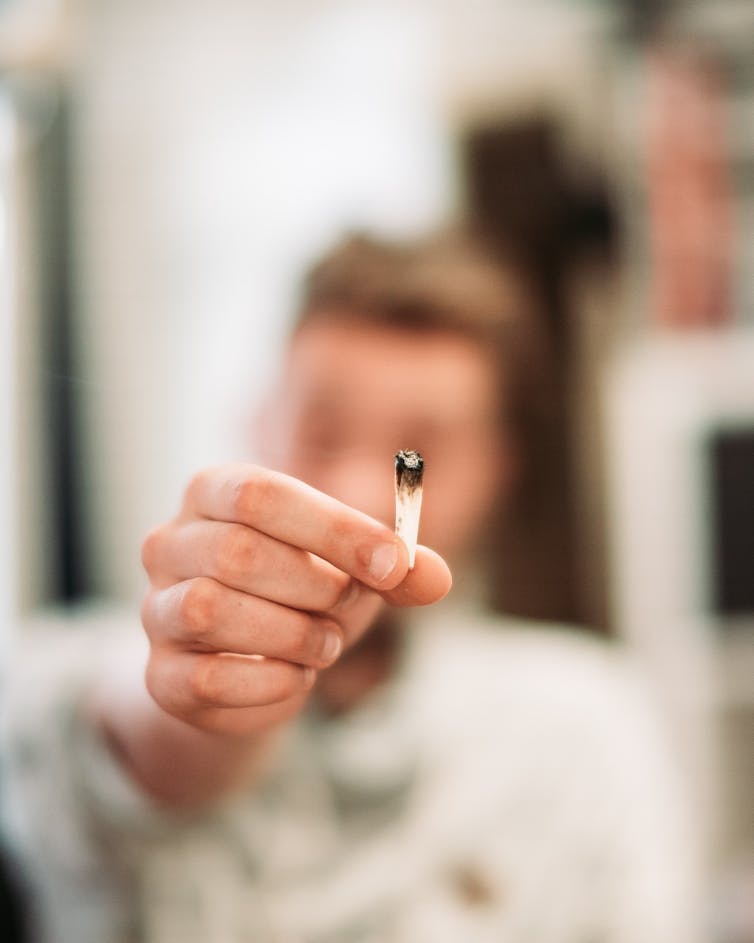 Hand holding a joint