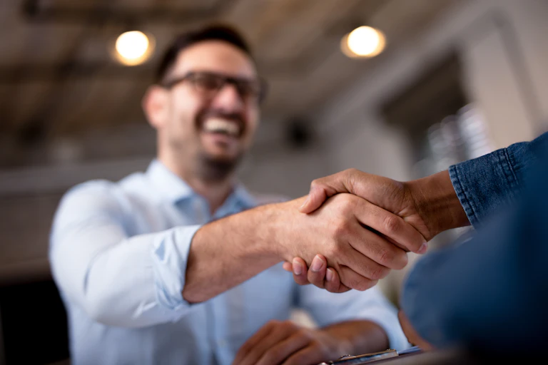 Two people shaking hands,