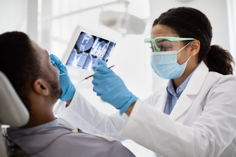 Dentist examining patient