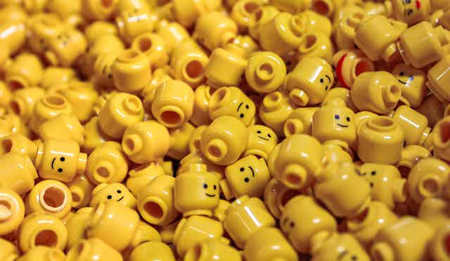 Pile of disembodied yellow Lego heads.