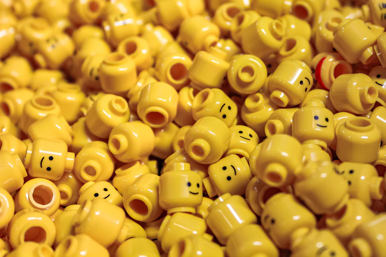 Pile of disembodied yellow Lego heads.