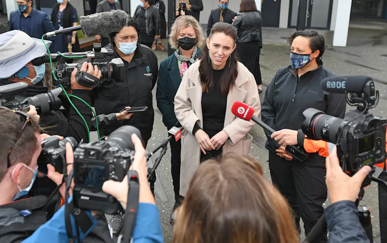 Jacinda Ardern talking to reporters outdoors