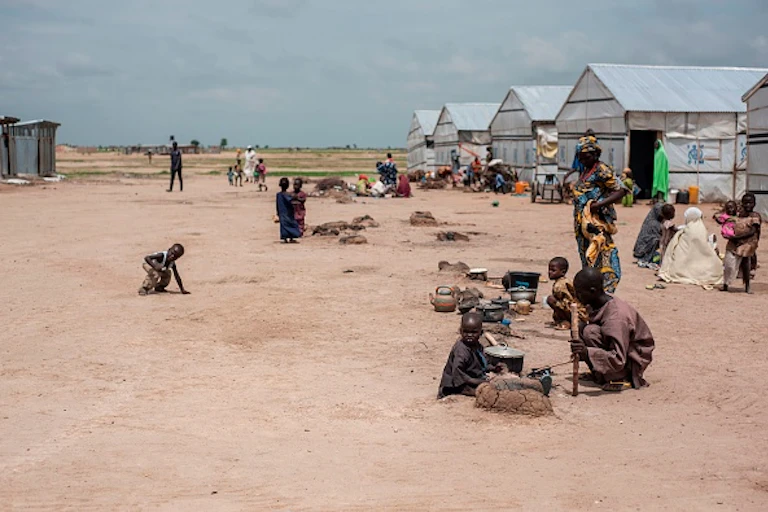 Children in camps with tents.