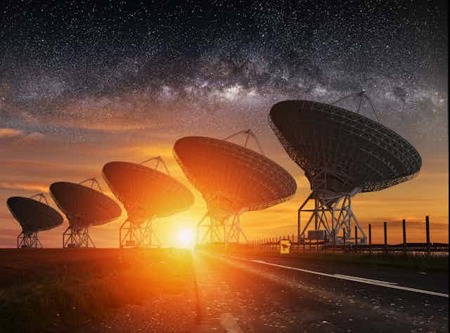 Image of radio telescopes under the Milky Way sky.