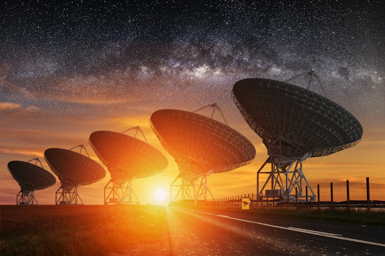 Image of radio telescopes under the Milky Way sky.