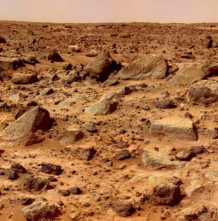 The dry rocky and sandy orange surface of Mars
