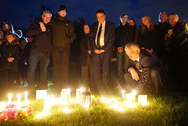 Mourners lighting candles in Essex.