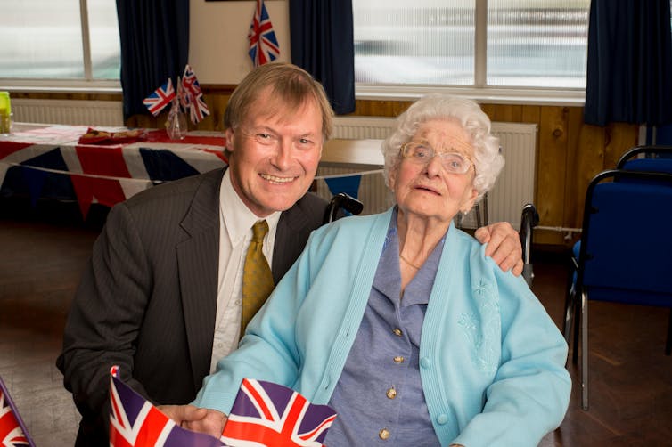 David Amess posing for a photo with a local member of the Conservative Party in Leigh on Sea, Essex