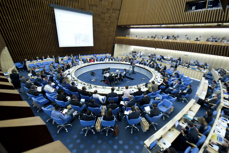 People sit in circles at a meeting