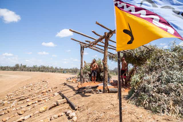 Wangan and Jagalingou Traditional Owners performing continuous cultural ceremony at the edge of Adani’s Carmichael mine in central Queensland.