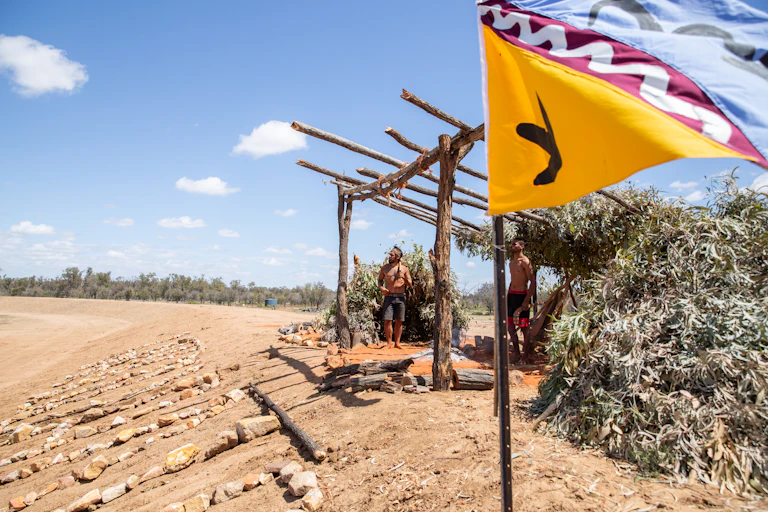 Wangan and Jagalingou Traditional Owners performing continuous cultural ceremony at the edge of Adani’s Carmichael mine in central Queensland.