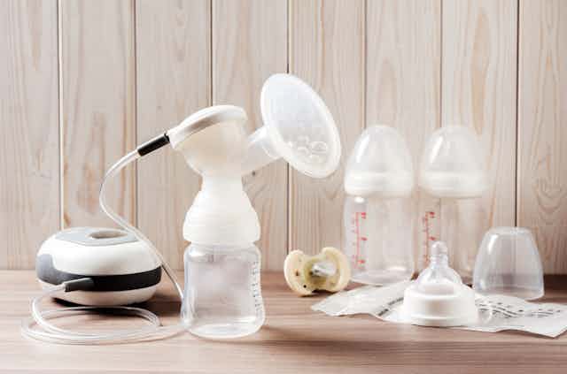Milk pump with milk bottles in the background