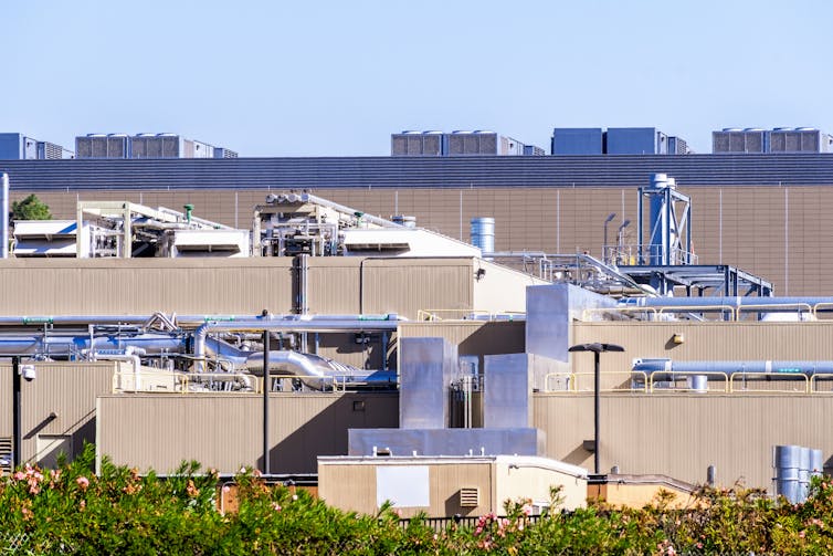 Warehouse building with external fans and pipes