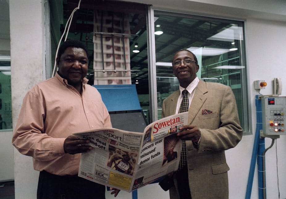 Aggrey Klaaste, right, used the Sowetan newspaper to drive his Nation-building campaign. He is seen here with John Mabato, the newspaper's production manager. 