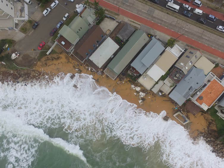 ocean rises up to homes