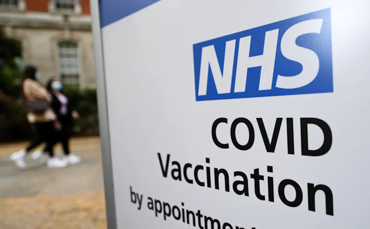 A sign for an NHS COVID vaccine centre