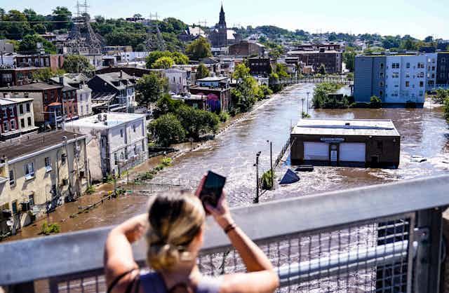 View from a bridge of streets underwater.