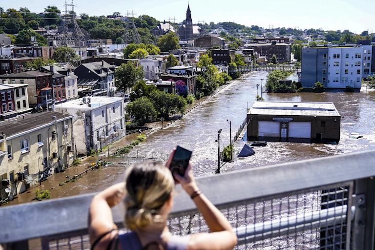 View from a bridge of streets underwater.