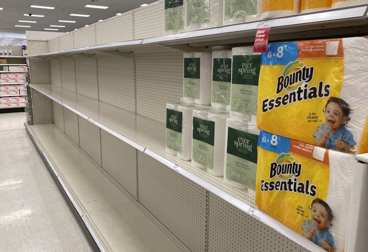 Paper towel shelves more than two-thirds empty