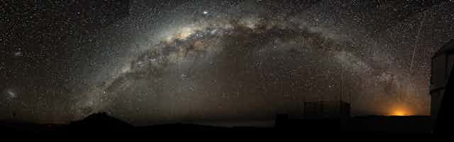 The Milky Way arching at a high inclination across the night sky.