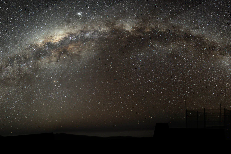 The Milky Way arching at a high inclination across the night sky.