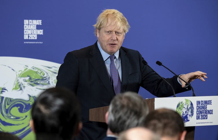 man at lectern