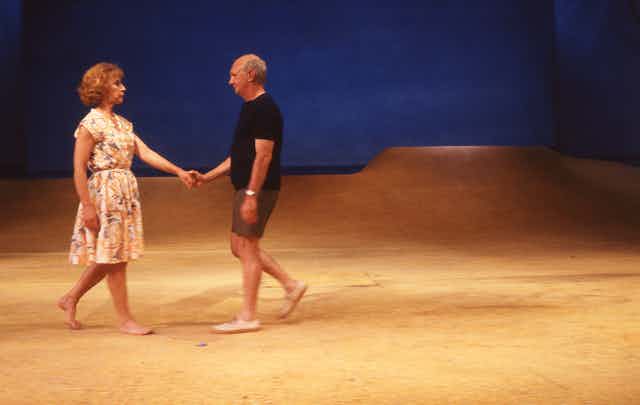 A man and a woman on a set of a beach