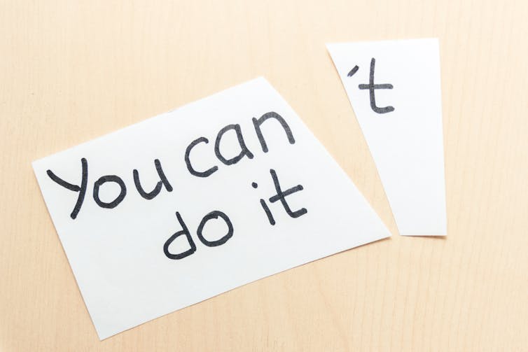 Piece of paper with words 'You can't do it' torn in two so it becomes 'You can do it'