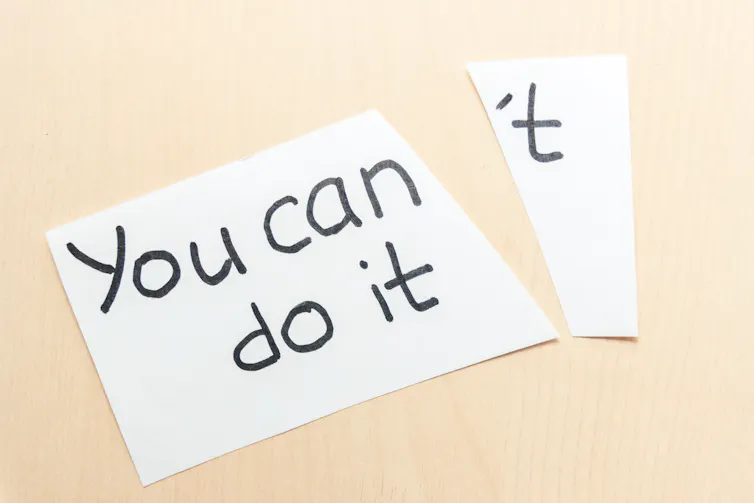 Piece of paper with words 'You can't do it' torn in two so it becomes 'You can do it'
