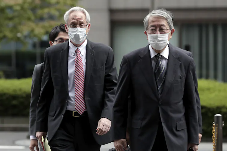 Former Nissan executive Greg Kelly (left) attending his trial in Tokyo.