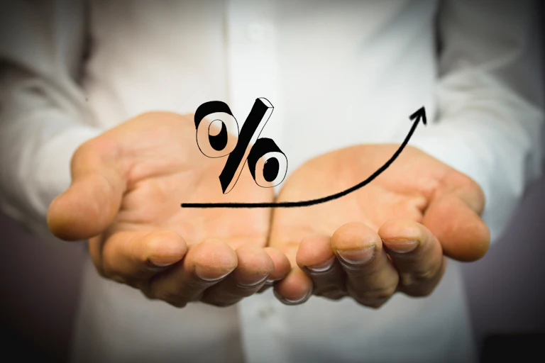 Hands holding a percentage sign