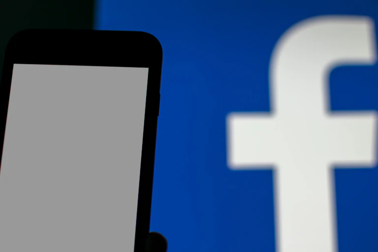 Facebook logo and a phone.