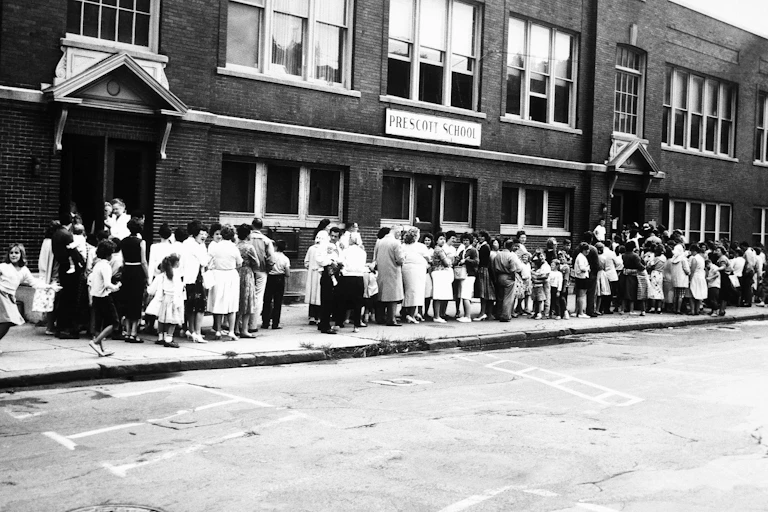 people lined up outside a school