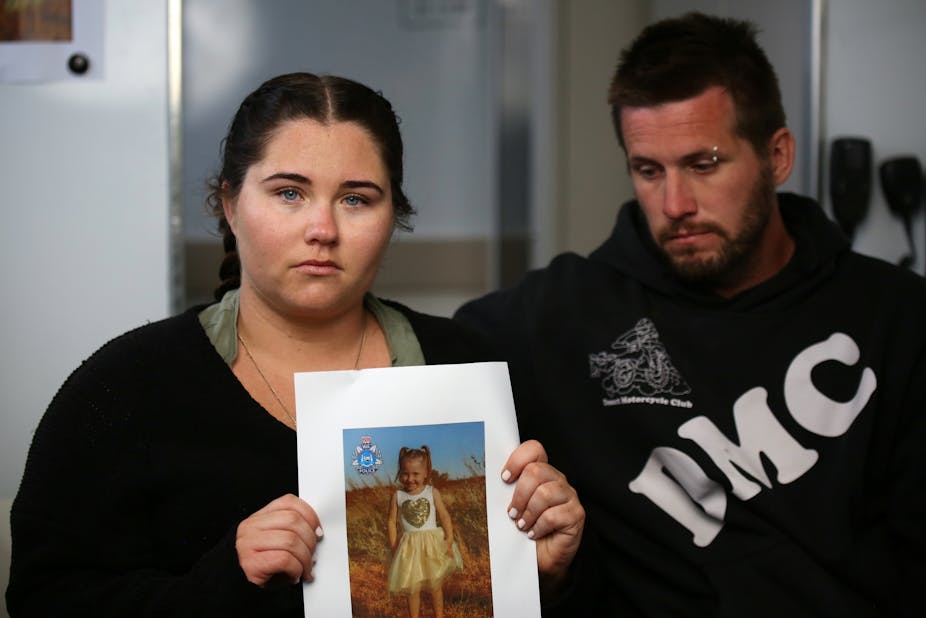 Parents of missing Cloe Smith hold up image of child at media conference