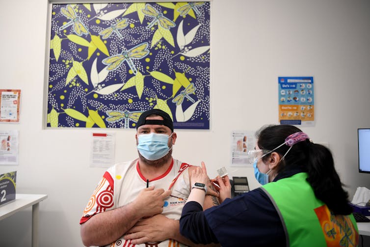A person is receiving a COVID-19 vaccination.