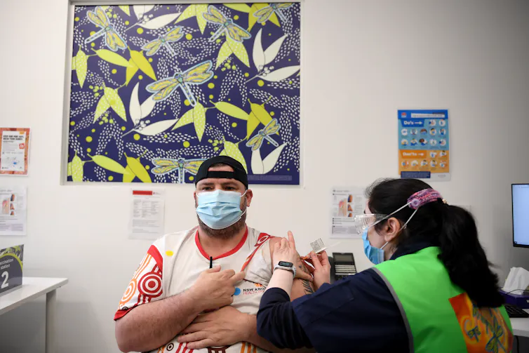 A person is receiving a COVID-19 vaccination.