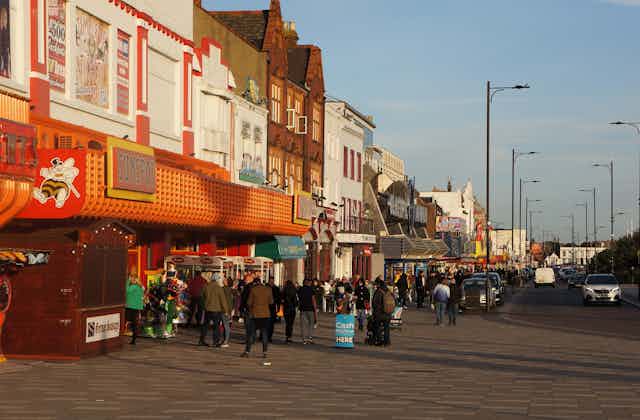 People walk along the seafront of Southend-on-Sea