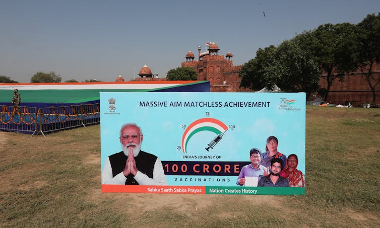 A sign celebrating India administering one billion COVID vaccine doses domestically